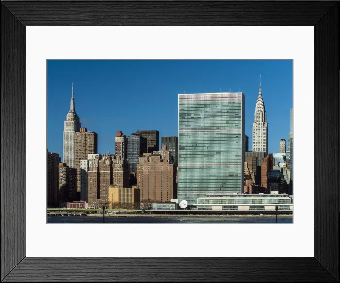 Framed Print : Manhattan skyline with the Headquarters of the United Nations, Empire State Building Framed Print : Manhattan skyline with the Headquarters of the United Nations, Empire State Building