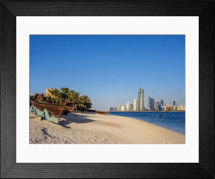 Framed Print : Traditional boats in the Heritage Village and city skyline in the background, Abu Dhabi Framed Print : Traditional boats in the Heritage Village and city skyline in the background, Abu Dhabi