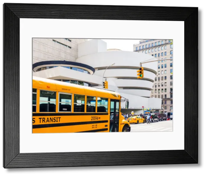 Framed Print : School bus passing the Solomon R Guggenheim museum, Manhattan, New York, USA Framed Print : School bus passing the Solomon R Guggenheim museum, Manhattan, New York, USA