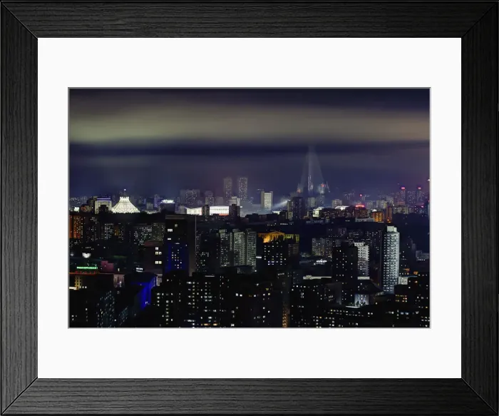 Framed Print : Pyongyang, new modern buildings in the centre of Pyongyang colourfully illuminated Framed Print : Pyongyang, new modern buildings in the centre of Pyongyang colourfully illuminated