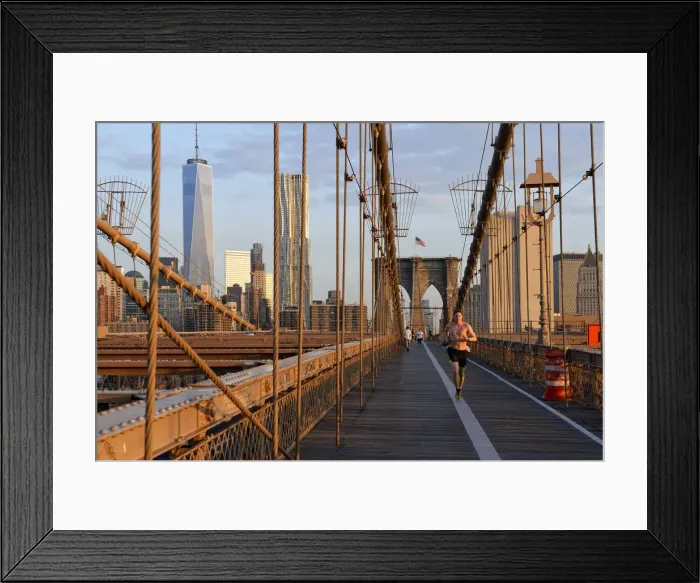 Framed Print : USA, New York, Brooklyn Bridge, man running over Brooklyn brighe in the morning