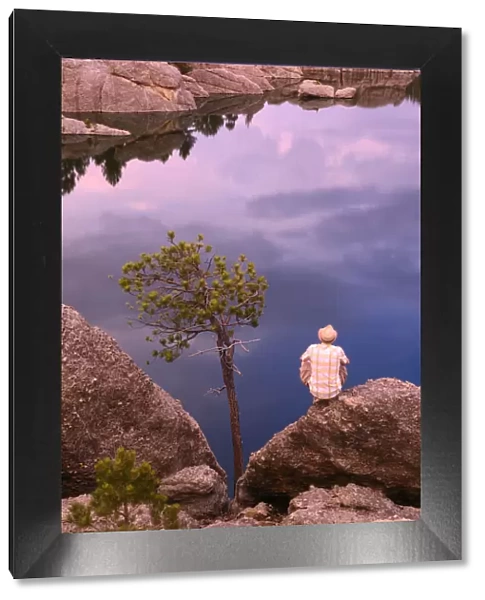 Person standing on rocks, Sylvan Lake, Custer State Park, Black Hills, Custer County