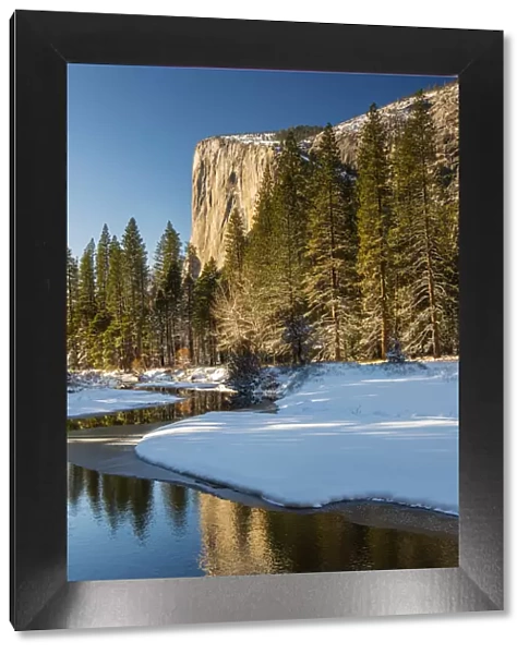 Scenic winter landscape with El Capitan mountain reflected in the river, Yosemite