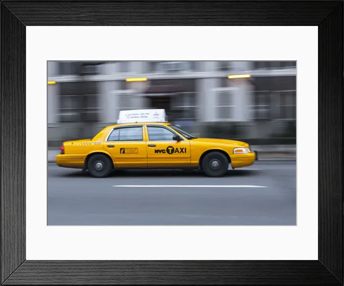 Framed Print : USA, New York, New York City, yellow city cab speeding along a New York street Framed Print : USA, New York, New York City, yellow city cab speeding along a New York street
