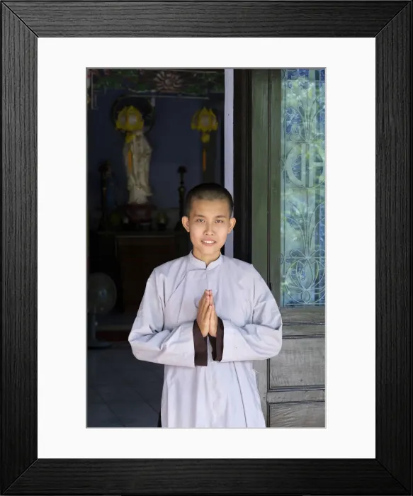 Framed Print : Asia, South East Asia, Vietnam; Hue; a Vietnamese Buddhist nun with her hands held Framed Print : Asia, South East Asia, Vietnam; Hue; a Vietnamese Buddhist nun with her hands held