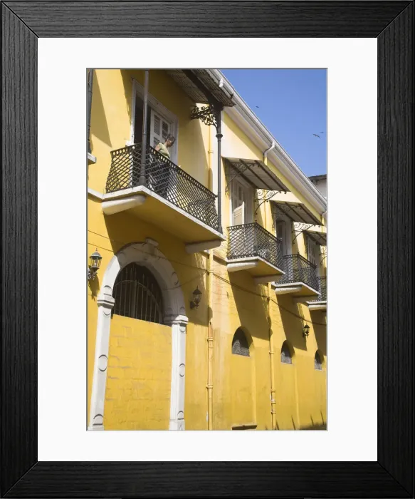 Framed Print : Panama, Panama City, Woman standing on balcony in Casco Viejo (San Felipe)
