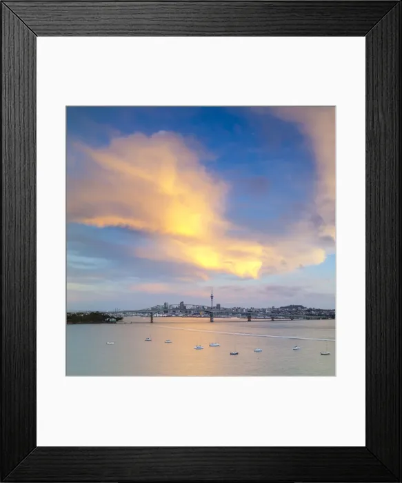 Framed Print : Elevated View Towards the Harbour Bridge and Central Business District illuminated at sunset, Auckland