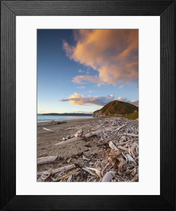 Framed Print : Picturesque beach illuminated at sunset, Mahia Peninsula, North Island, New Zealand Framed Print : Picturesque beach illuminated at sunset, Mahia Peninsula, North Island, New Zealand