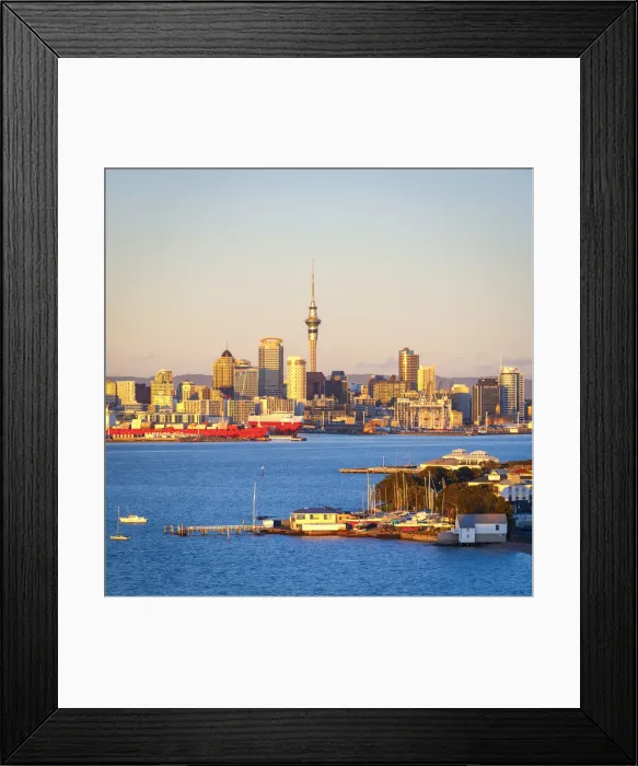 Framed Print : Elevated View Over Devenport towards Central Business District illuminated at sunrise, Auckland, New Zealand Framed Print : Elevated View Over Devenport towards Central Business District illuminated at sunrise, Auckland, New Zealand