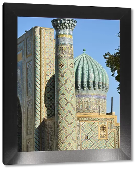 Sher-Dor Madrasah and minaret at the Registan square. A Unesco World Heritage Site