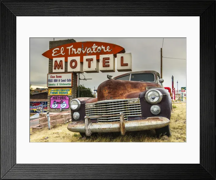 Framed Print : Old rusted Pontiac car and vintage motel sign behind along the historic U. S. Route 66 Framed Print : Old rusted Pontiac car and vintage motel sign behind along the historic U. S. Route 66