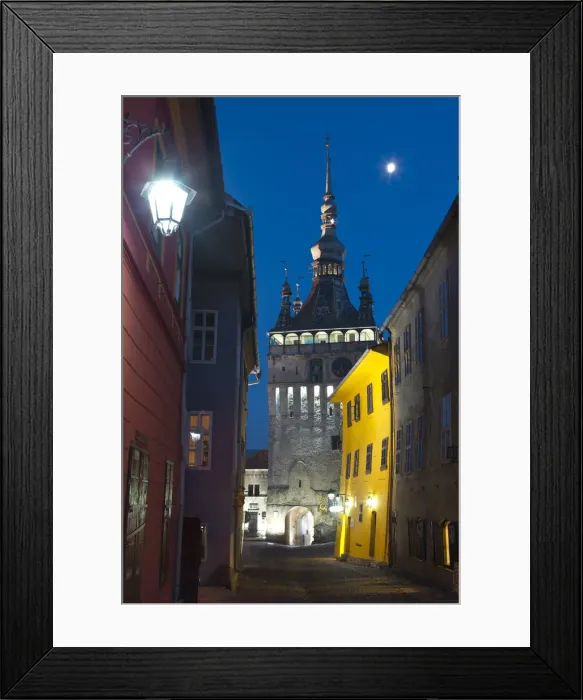 Framed Print : Clock Tower illuminated at dusk, Sighisoara, Transylvania, Romania Framed Print : Clock Tower illuminated at dusk, Sighisoara, Transylvania, Romania