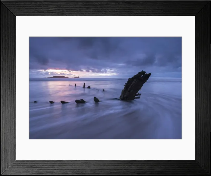 Framed Print : Shipwreck of the Helvetia on Rhossili Beach, looking towards Worms Head at sunset Framed Print : Shipwreck of the Helvetia on Rhossili Beach, looking towards Worms Head at sunset