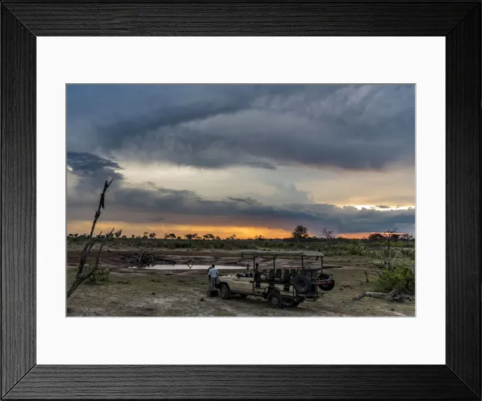Framed Print : Africa, Zimbabwe, Hwange National park. A stop for a sundowner at a waterhole during Framed Print : Africa, Zimbabwe, Hwange National park. A stop for a sundowner at a waterhole during