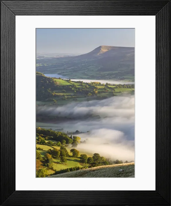 Framed Print : Early morning mist rolls over patchwork countryside in the Brecon Beacons National Park Framed Print : Early morning mist rolls over patchwork countryside in the Brecon Beacons National Park