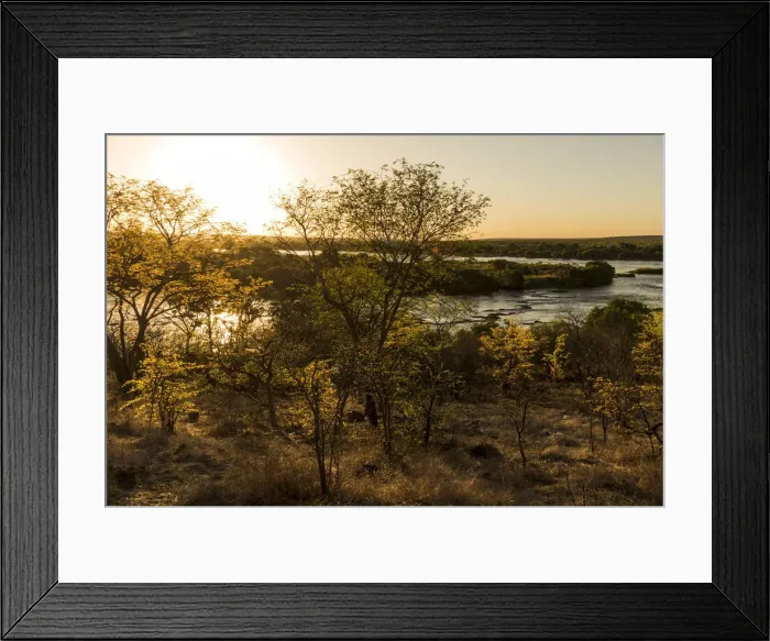 Framed Print : Africa, Zimbabwe, Matabeleland north. Rich, late afternoon light on the bush and over Framed Print : Africa, Zimbabwe, Matabeleland north. Rich, late afternoon light on the bush and over
