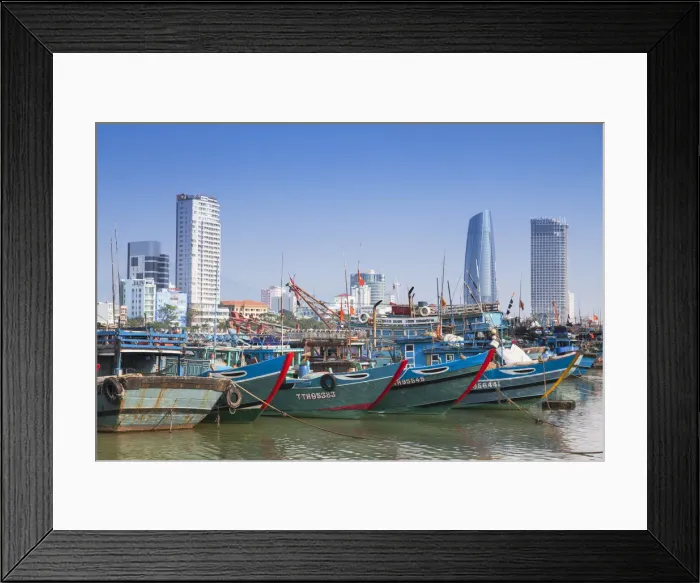 Framed Print : Fishing boats on Song River and city skyline, Da Nang, Vietnam Framed Print : Fishing boats on Song River and city skyline, Da Nang, Vietnam