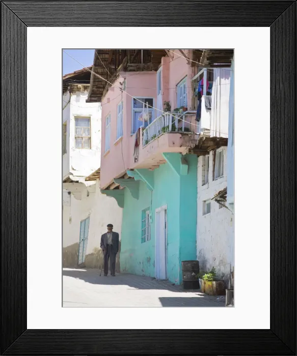 Framed Print : Turkey, Eastern Turkey, Malatya, Gunduzbey Village, Man walking along street past Framed Print : Turkey, Eastern Turkey, Malatya, Gunduzbey Village, Man walking along street past