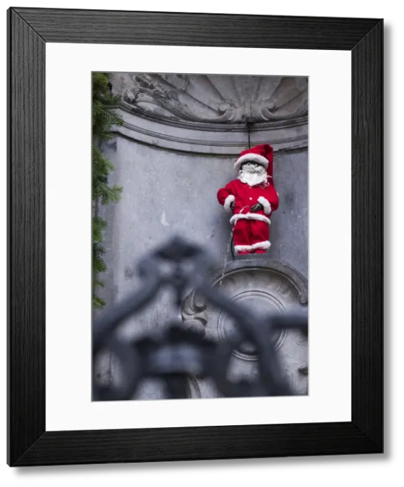 Framed Print : Belgium, Brussels, Manneken Pis, fountain statue and a symbol of Brussels, wearing Framed Print : Belgium, Brussels, Manneken Pis, fountain statue and a symbol of Brussels, wearing