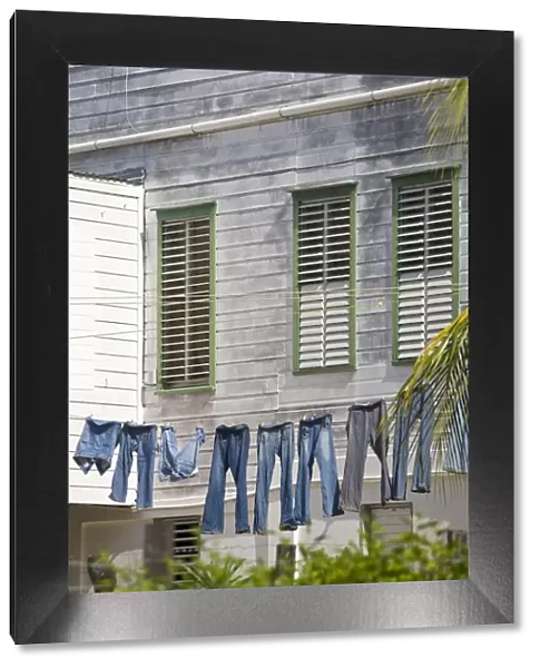 Belize, Belize City, Fort George District, Jeans hanging up on washing line infront