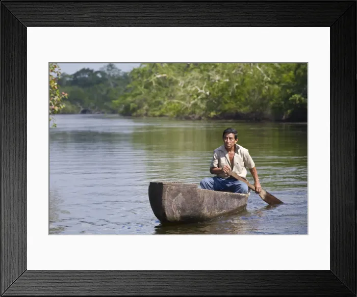 Framed Print : Belize, Lamanai, New River, Fisherman in dug out canoe