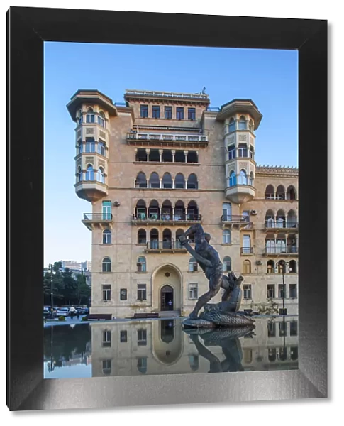 Azerbaijan, Baku, Residential building reflecting in Bharam fountain