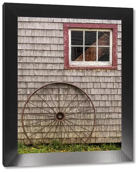 Canada, Prince Edward Island, Orwell, barn with old wagon wheel