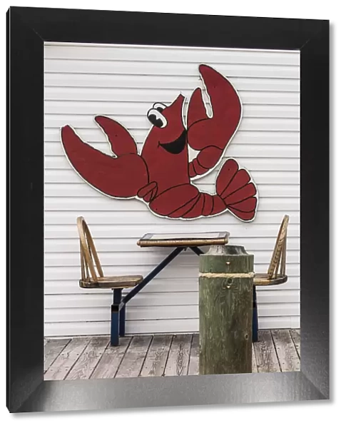 Canada, Prince Edward Island, Summerside, lobster cartoon on wall of seafood restaurant