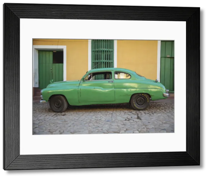 Framed Print : Cuba, Trinidad, Classic American car in historical center