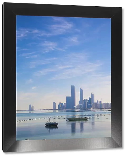 United Arab Emirates, Abu Dhabi, View of City skyline reflecting in Persian Gulf