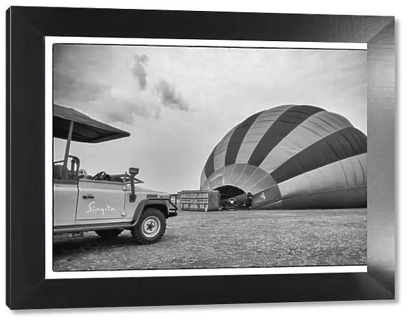 Singita safari car with hot air balloon in black and white, Serengeti Grumeti Reserve