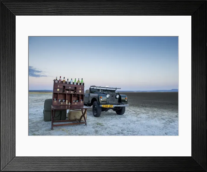 Framed Print : Ancient landrover and sundowner table on salt pan Framed Print : Ancient landrover and sundowner table on salt pan