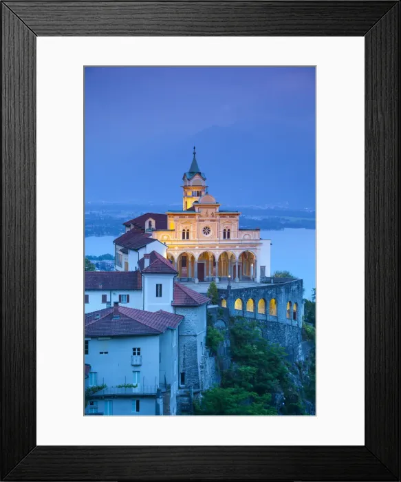 Framed Print : Elevated view over the picturesque Sanctuary of Madonna del Sasso illuminated at dusk