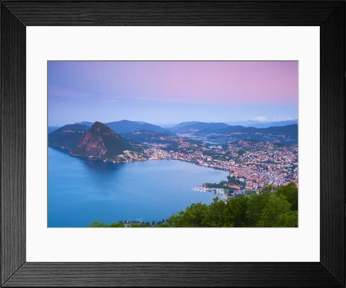 Framed Print : Elevated view over Lugano from Monte Bre illuminated at sunrise, Lugano, Lake Lugano