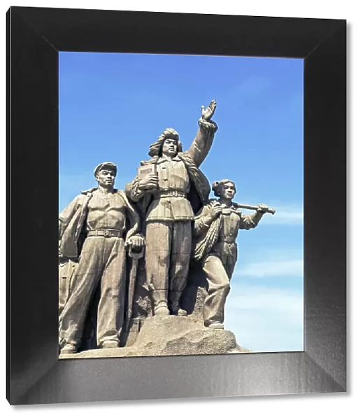 China, Beijing, Statue of marching Chinese army soldiers in front of Chairman Mao