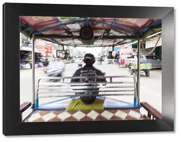 Cambodia, Battambang, view from inside a remorque motorbike taxi, motion blur