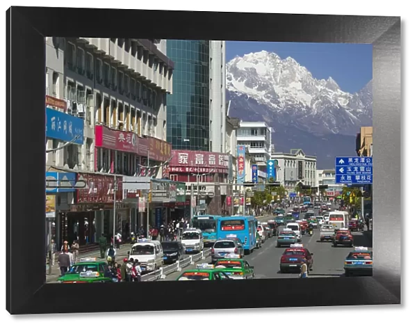 China, Yunnan Province, Lijiang, New Town, view along Xin Dajie Street towards Jade