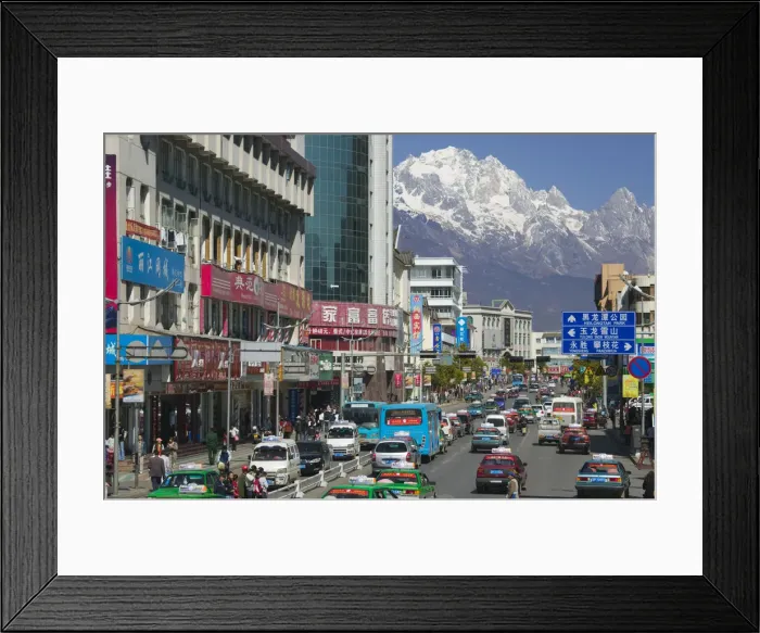 Framed Print : China, Yunnan Province, Lijiang, New Town, view along Xin Dajie Street towards Jade Framed Print : China, Yunnan Province, Lijiang, New Town, view along Xin Dajie Street towards Jade