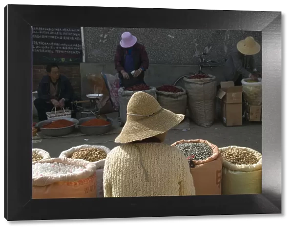 China, Yunnan Province, Erhai Hu Lake Area, Xizhou, market, nut vendor