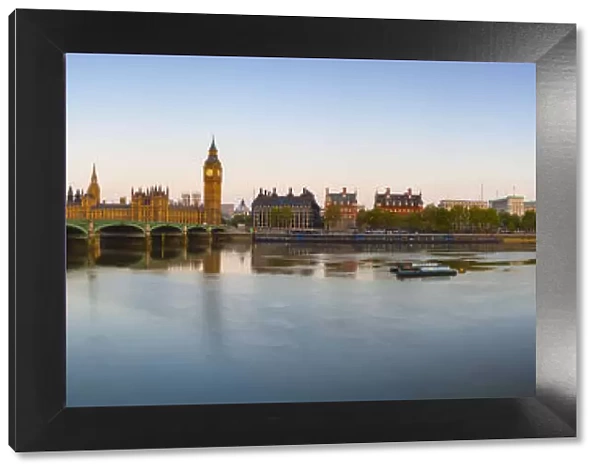 The Houses of Parliament & The River Thames illuminated at dawn