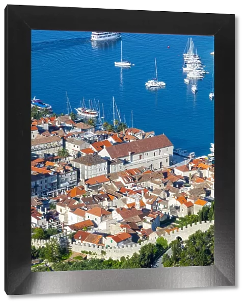 Elevated view over the picturesque harbour town of Hvar, Hvar, Dalmatia, Croatia