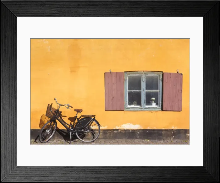 Framed Print : Denmark, Zealand, Copenhagen, yellow building detail with bicycle