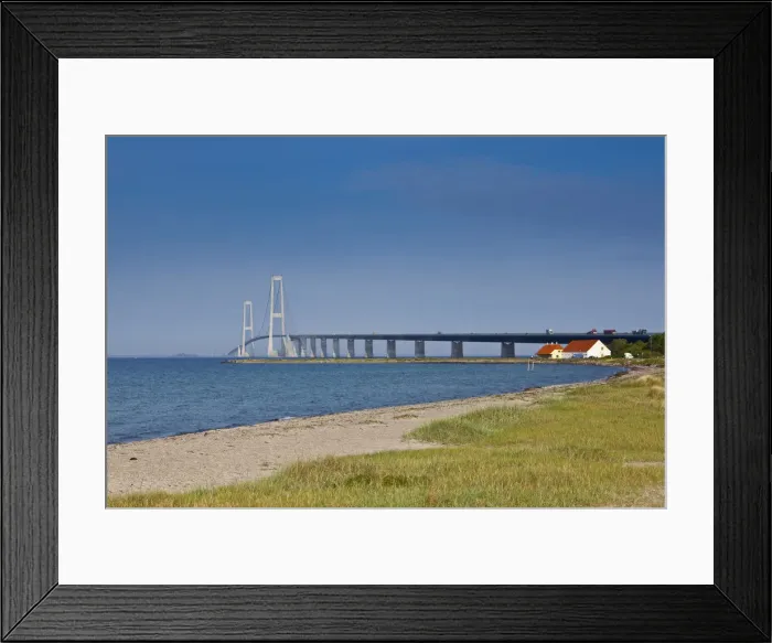 Framed Print : A white sand beach leads towards the East Bridge as seen from Korsor, Denmark Framed Print : A white sand beach leads towards the East Bridge as seen from Korsor, Denmark