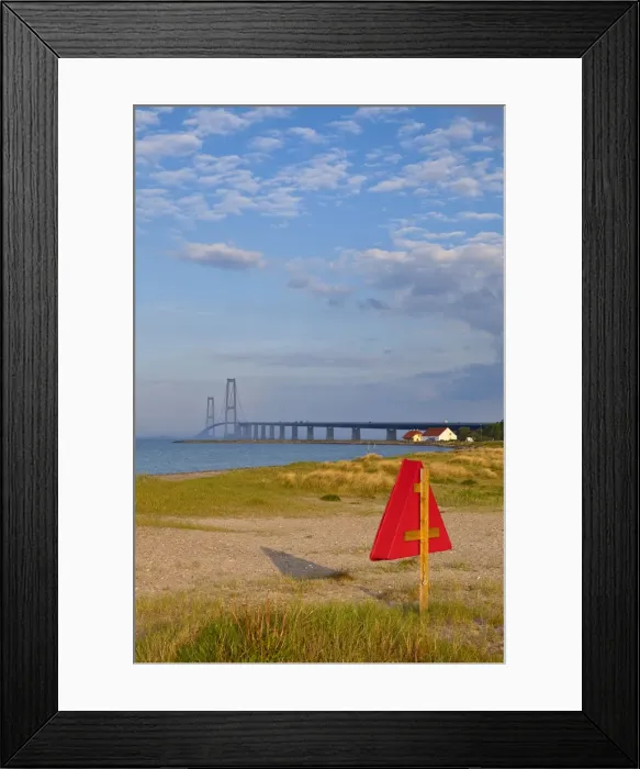 Framed Print : Warm afternoon light illuminates a sandy beach leading towards the East Bridge, Korsor Framed Print : Warm afternoon light illuminates a sandy beach leading towards the East Bridge, Korsor