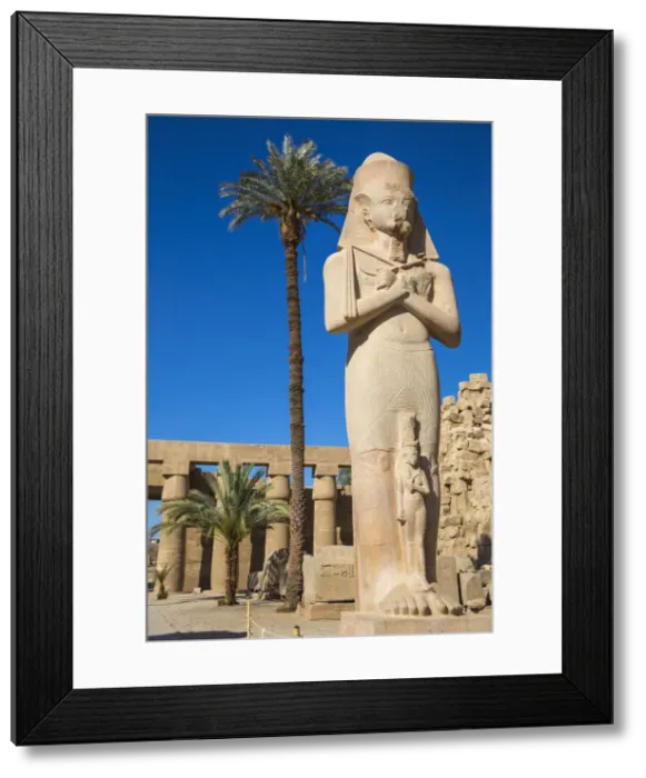 Framed Print : Egypt, Luxor, Karnak Temple, Colossal statue of King Ramesses II with his daughter