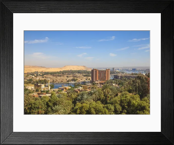 Framed Print : Egypt, Upper Egypt, Aswan, View of New and old Cataract Hotel with Khnum ruins in