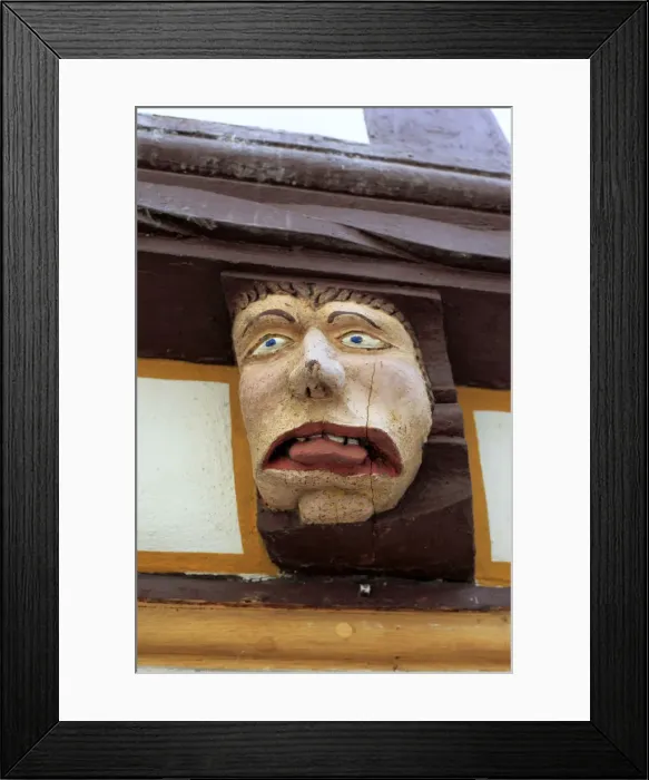 Framed Print : Sculpture on facade of medieval house, Limburg an der Lahn, Hesse, Germany Framed Print : Sculpture on facade of medieval house, Limburg an der Lahn, Hesse, Germany