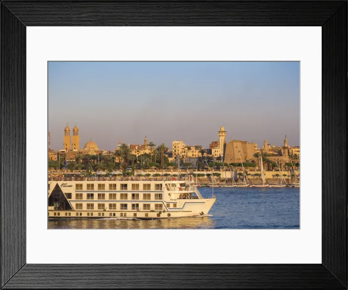 Framed Print : Egypt, Luxor, Nile cruise boat passing intont of Luxor temple
