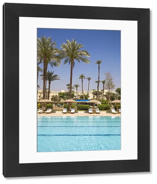 Egypt, Luxor, Swimming pool in the Garden at the The Winter Palace Hotel