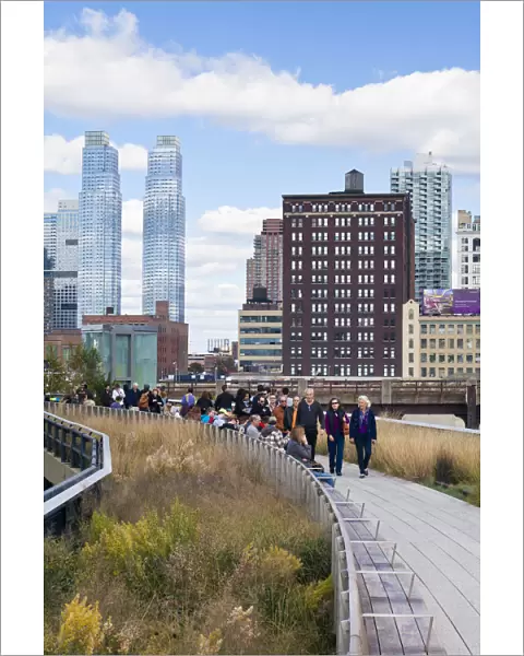 People walking on the High Line, a 1-mile New York City park on a section of former